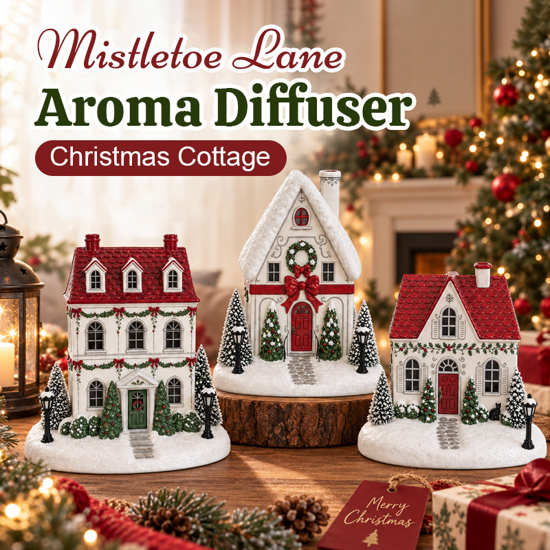 🎄✨ Diffuseur « La maison de Noël de Mistletoe Lane » — Diffuseur festif représentant un village de Noël avec des fenêtres illuminées et une charmante brume de cheminée