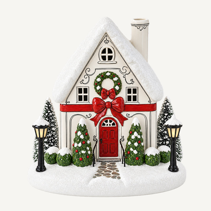 🎄✨ Diffuseur « La maison de Noël de Mistletoe Lane » — Diffuseur festif représentant un village de Noël avec des fenêtres illuminées et une charmante brume de cheminée